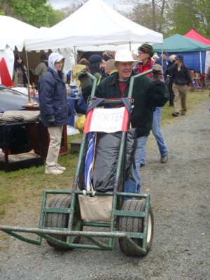 Porter with self welded oversize hand trolley in the Hertain Antique Show.