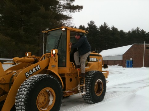 Alexander Haney exiting the Front Loader with his cowboy boots