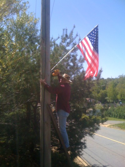Leo-Gregoire-mounting-a-flag-on-Brimfield-Road