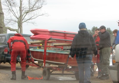 Kyle-and-his-parents-Michael-and-Holly-Rutkowski-to-the-right-of-the-trailer-loading-rescue-equipment-after-the-rescue